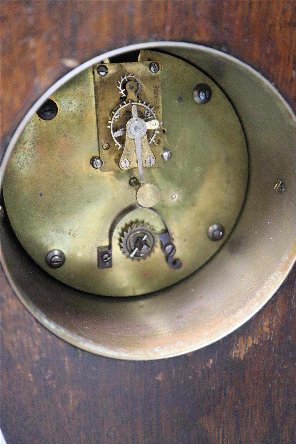 An Art Nouveau inlaid oak mantel clock, convex dial and French movement, case inlaid with copper strapwork, 28cm